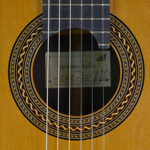 Rosette and label of a sandwich topped guitar built by Antonius Müller