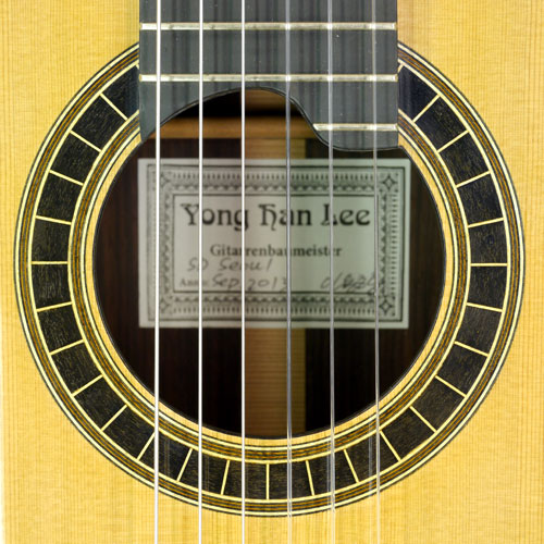 rosette and label of Yonghan Lee sandwich topped guitar, cedar, rosewood, 2013